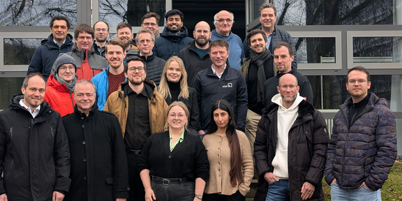 The picture is a group foto of at the 4th status meeting of ENPRO REUNION.