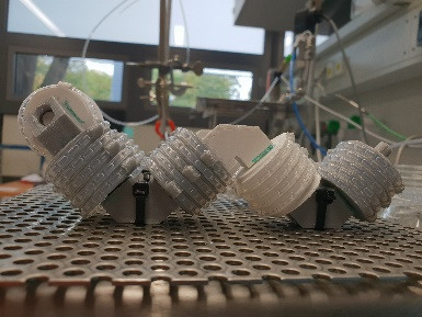 The image shows a 3D-printed CFI microreactor.