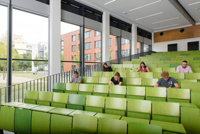 Students in lecture hall Students are sitting in a lecture hall.
